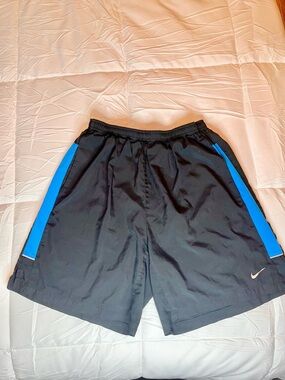 Nike Men’s Black Athletic Shorts with Blue Side Stripes